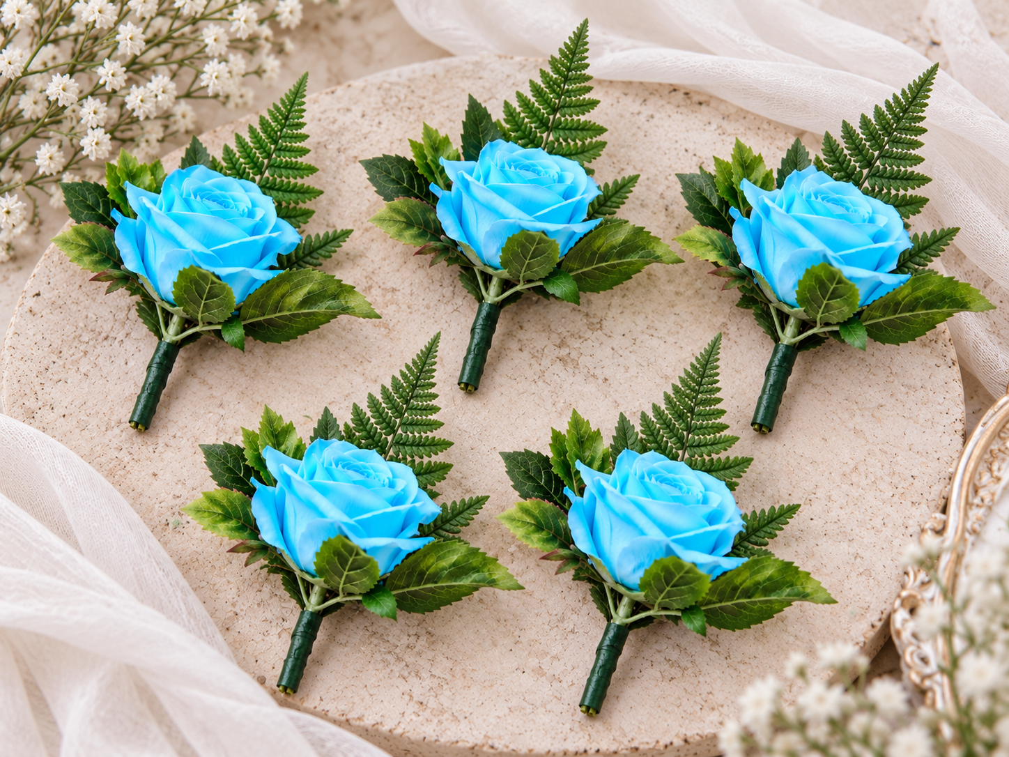 Coordinating blue rose wedding buttonholes