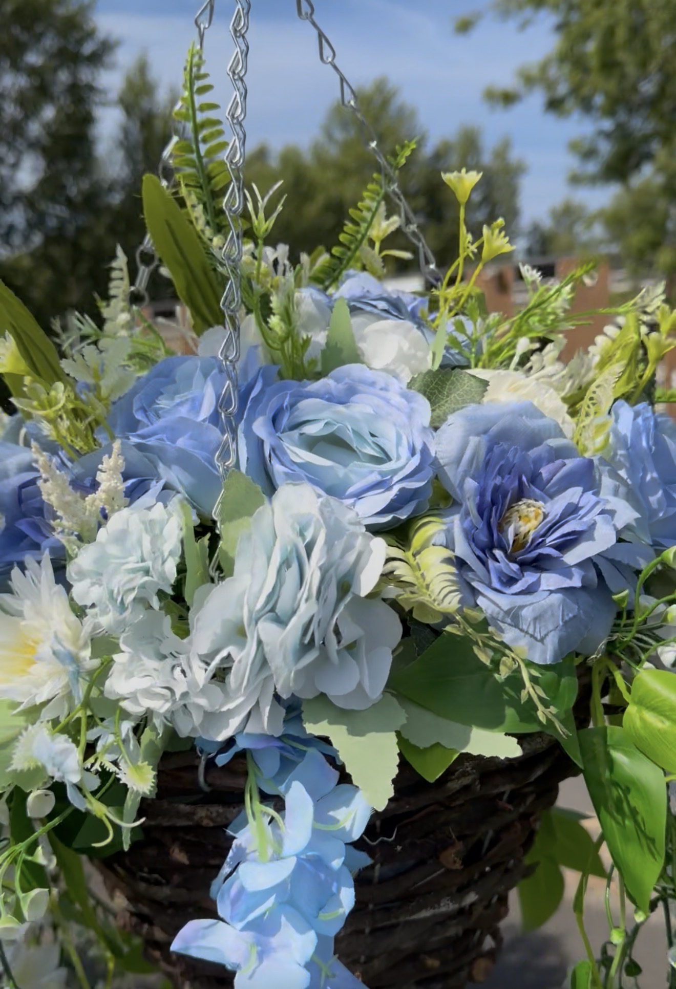 Blue artificial floral hanging basket by Lumielle Bloom